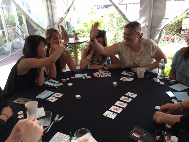 Poker Divas - two women high five